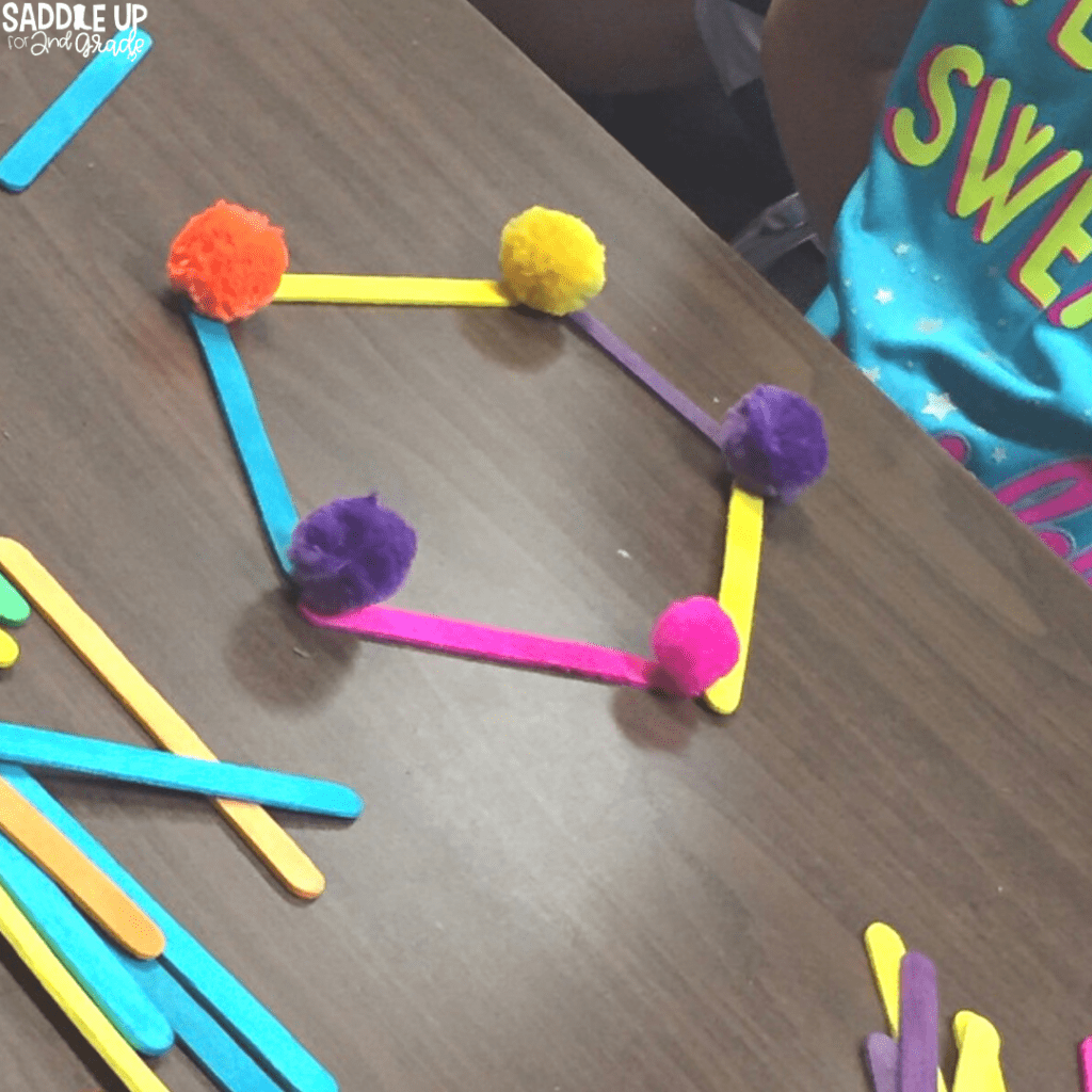 Popsicle sticks and pom poms for geometry activity
